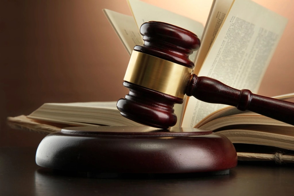 Judge's gavel on an open book.
