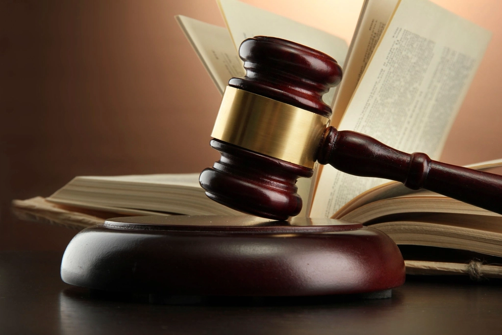 Judge's gavel on an open book.